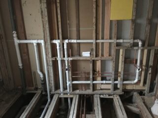 Kitchen plumbing remodel with new fixtures and pipes