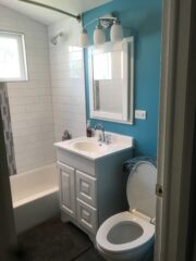 24/7 emergency plumbing service fixing a burst pipe in kitchen