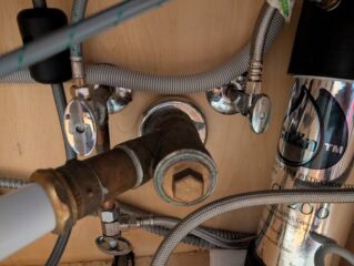 Drain cleaning and clog removal for plumbing systems